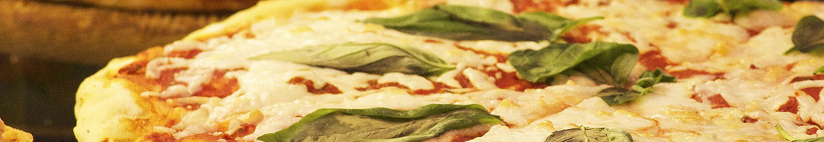 Eating Italian Pizza at Giuseppes Ristorante Italiano restaurant in Nellysford, VA.
